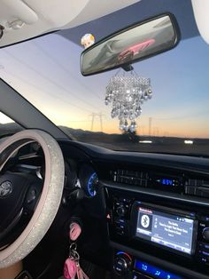 the interior of a car is decorated with crystal beads