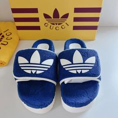 Elevate Your Style Game With These Stunning Authentic Gucci X Adidas Gg Platform Slides/Sandals In Blue. These Designer Slides Are Perfect For Casual Occasions And Are Guaranteed To Make A Statement. The Slip-On Closure Makes It Easy To Wear Them, And The Adjustable Feature Ensures A Comfortable Fit. The Upper Material Is Made Of High-Quality Terry-Cloth Like Material. The Non-Slip Feature Adds An Extra Layer Of Safety And Ensures That You Can Wear Them Confidently. Gucci White Sneakers With Textured Sole, Gucci Casual Slip-on Slides, Casual Gucci Slip-on Slides, Blue Gucci Sneakers With Branded Insole, Luxury Gucci Slides With Rubber Sole, Gucci Blue Round Toe Sneakers, Blue Gucci Sneakers With Round Toe, Designer Blue Gucci Sneakers, Gucci Designer Slides With Cushioned Footbed