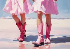 two girls in pink dresses and cowboy boots standing next to each other