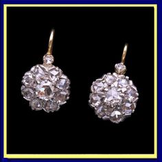 Antique Victorian era diamond earrings. 18k yellow gold, silver and diamonds. Made in France, 19th century - circa 1860 - 1890. Independent appraisal and certificate. Measurements: Weight is 5.10 grams. 2.54ct rose cut diamonds. diamonds, excluding gold wires approximately 5/8 inch (16mm) top to bottom. Description : Classic flower-form earrings with beautiful rose cut diamonds forming the centers and petals of the flowers. Small rose cut diamond surmounts from 18k gold wires. As was the custom of the period, diamonds were set in silver over gold to show them off to better effect in candle or gas light. Backs and mounts entirely gold. Hinged clasps for wires. Easy to insert and very secure. Beautiful gems and beautifully made, these earrings are as versatile and wearable today as they were Small Rose, Gold Wire, Rose Cut Diamond, Antique Victorian, Victorian Era, Beautiful Roses, Rose Cut, Made In France, Jewelry Earrings Dangle