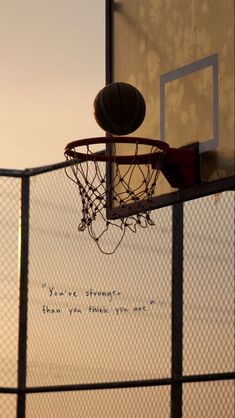 a basketball hoop with an inspirational quote on it