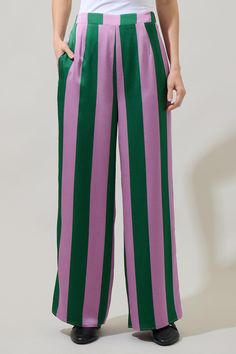 The Rag Stripped Wide Leg Pants are retro-chic and ready for summer! A stripped pattern with elastic waistband hugs the waist, while sitting high. The pant legs open up to create the perfect wide leg fit. Style them with the matching top and a cami tank. - Elastic waist- High waisted- Wide leg- Flowy- Color: Green MultiSize + Fit - Model is 5'8" and wearing size XS- Measurements taken from size S - Waist: 28 1/2" - Inseam: 29 1/4" Fabric Self: 100% Polyester, Lining: 97% Polyester 3% Spandex Sty Stripe Pants Outfit, Stripped Pattern, Cute Disney Outfits, Striped Wide Leg Pants, Purple Pants, Retro Clothing, Retro Chic, Disney Outfits, Matching Top