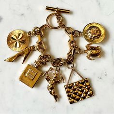 Cheaper On Vestiaire! Vintage Chanel Iconic Charms Toggle Bracelet. Marked On Clasp. 24k Plated. Some Mild Areas Of Tarnishing Especially On The Inside Part Of The Chain Links, Parts Of Toggle And Clasp As Well As Some Plate Loss On The Purse Charm But In Otherwise Great Vintage Condition. 8 Inches Across From Toggle To Clasp. Cheaper Offline. Message Me On Ins.Ta With Same Username. Jewelry Moodboard, Chanel Charms, Chanel Charm Bracelet, Vintage Charm Bracelet, Charms Bracelet, Gold Charm Bracelet, Toggle Bracelet, Chanel Jewelry, Chain Links