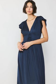 Just a few reasons to adore this V-neck maxi dress: ruffled shoulder panels, billowy shoulder sleeves, and the way all those pleats flow to a slightly asymmetrical hem. So pretty. •V-neck •Ruffled shoulder panels •Elasticized waist •Pleated •Asymmetrical hem •Relaxed fit DIMENSIONS •Standard: 51" Length Item number 2290084CA100% Polyester V-neck Ruffle Hem Maxi Dress For Date Night, Navy Ruffled Midi Dress, Navy Ruffled Midi Dress For Summer, Navy Midi Dress With Ruffles, Navy Midi-length Dress With Ruffles, Navy Midi Dress With Ruffles For Summer, Blue V-neck Maxi Dress With Pleated Bodice, Ruched Flutter Sleeve Maxi Dress For Brunch, Chic Midi Dress With Ruffles And Empire Waist