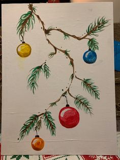 a painting of christmas ornaments hanging from a tree branch