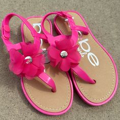 Pink Bebe Sandals Flower Design Silver Accent Adjustable Snap Closure Flower Shaped Synthetic Flip Flops For Beach, Synthetic Flower Flip Flops For Beach, Cute Adjustable Jelly Sandals For Beach, Pink Flower Sandals For Vacation, Pink Sandals, Design Silver, Silver Accents, Flower Design, Flower Designs