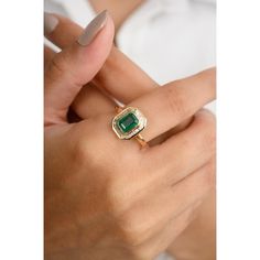 This 18k gold statement ring showcases an octagon-cut center emerald, surrounded by a dazzling baguette-cut diamond halo. The vibrant green emerald contrasts beautifully with the sparkling diamonds, creating a captivating and luxurious piece. Perfect for special occasions, this ring exudes sophistication and timeless elegance, making it a must-have addition to any jewelry collection. Emerald enhances intellectual capacity of the person.  Designed with octagon cut emerald set with halo diamonds t Heirloom Emerald Ring, Emerald Engagement Ring Art Deco, Baguette Halo, Vintage Cocktail Rings, Emerald Band Ring, Colombian Emerald Ring, Emerald Set, Mom Wedding Gift, Emerald Wedding Rings