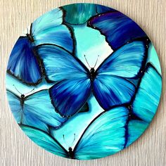 a plate with blue butterflies painted on it