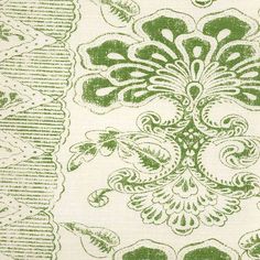 green and white fabric with an ornate design