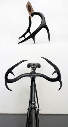 the front end of a bicycle with antlers on it