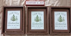 three framed christmas trees are on display