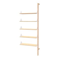 a wooden shelf with three white triangles on it