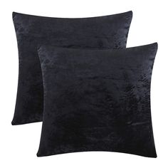 two black velvet pillows on a white background