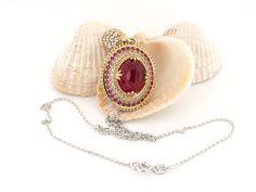 WELCOME TO SUSANJEWELYGIFTS This ruby oval necklace is a stunning and unique accessory that will add a touch of elegance and charm to your look. The pendant features a large oval 10x12 mm ruby stone in the center, surrounded by small round ruby and zircon stones that create a dazzling contrast. The pendant is made of silver and bronze, and hangs from a 925 sterling silver necklace chain that is durable and stylish. You can choose to buy the pendant alone or as a set with the chain. This necklace is a perfect gift for women who love handmade jewelry and red stone accessories. Ruby is also the birthstone for July, making this necklace a meaningful birthday gift for your loved ones. Whether you wear this necklace for a special occasion or a casual day, you will surely impress everyone with yo Exquisite Oval Jewel Necklaces, Oval Jeweled Necklaces For Anniversary, Elegant Handmade Oval Cabochon Necklace, Jeweled Oval Pendant Necklace For Gifting, Jeweled Oval Pendant Necklace For Gifts, Gemstone Oval Cabochon Necklace For Wedding, Gold Necklaces With Oval Pendant And Stones, Oval Pendant Necklace With Jewels For Gift, Oval Cabochon Gemstone Necklace For Wedding