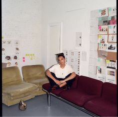 a person sitting on a couch in a room