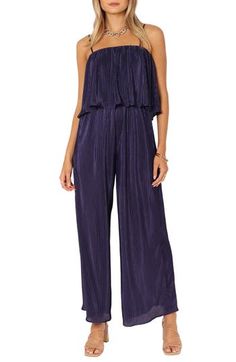 Retro vibes are alive in this '70s-inspired jumpsuit featuring a flouncy bodice, roomy legs and allover pleats. Pull-on style Adjustable straps Square neck Unlined 100% polyester Hand wash, dry flat Imported Casual Strapless Jumpsuit For Spring Evenings, Casual Strapless Jumpsuit For Evening In Spring, Chic Pleated Jumpsuits And Rompers For Spring, Chic Sleeveless Pleated Jumpsuits And Rompers, Sleeveless Pleated Jumpsuits And Rompers For Spring, Coverall Jumpsuit, 70s Inspired, Retro Vibe, Square Neck