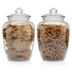 two glass jars filled with cookies and pretzels