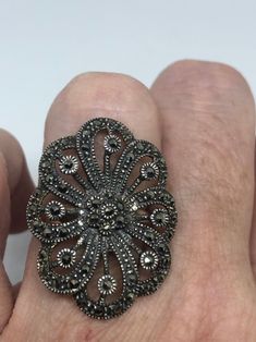 Vintage ring surrounded by Swiss cut fine Marcasite Sterling silver Size 7.5 can be sized by my jeweler. His service charge is $10- $15 All rings are shipped in a nice gift box. Check out our over a THOUSAND great reviews Engraving is $4 per letter and is not always perfect depending on the piece. It can take a few days if the jeweler is busy. This is payable to Paypal Judithsltd@gmail.com Antique Silver Cluster Ring As Gift, Silver Oval Cluster Ring Stamped 925, Victorian Style Silver Oval Cluster Ring, Victorian Silver Oval Cluster Ring, Silver Victorian Oval Cluster Ring, Marcasite Ring For Anniversary, Marcasite Ring Stamped 925, Victorian Marcasite Jewelry For Anniversary, Vintage Marcasite Ring Stamped 925