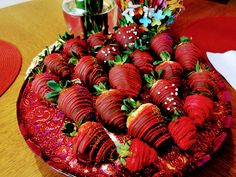 there are strawberries arranged on the plate and ready to be cut into pieces,