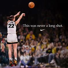 a woman jumping in the air with a basketball