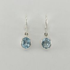 This is a  beautiful pair of Blue Topaz Earrings in 925 Sterling Silver. They are made out of Sterling Silver with no nickel so there should be no allergic reaction and nothing will turn green. The silver is not only silver plated or steel but solid 925 Sterling Silver. We usually ship the same day in a nice gift box. Blue Oval Hallmarked Earrings, Oval Ear Wire Earrings For Anniversary, Blue Topaz Earrings, Topaz Earrings, Allergic Reaction, Silver Drop Earrings, Solid 925 Sterling Silver, Blue And Silver, Beautiful Earrings