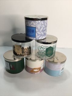 several different types of candles sitting on top of each other