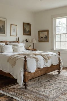 a large bed sitting in a bedroom on top of a rug