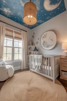 a baby's room with a crib, rocking chair and large round rug