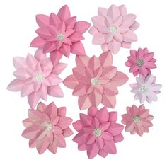 pink and white paper flowers with glitter centers on each flower, set against a white background