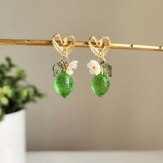 Discover the refreshing and zesty taste of lace heart lime earrings. There are many ways to incorporate these citrusy earrings into your daily outfit. Our lime lace heart stud earrings are made with Czech transparent glass lime, Czech opaque avocado lime, acrylic flowers, acrylic leaves and gold-plated lace heart stud earrings.Size: approx. ( W x L ) 0.5" x 1.25" Trendy Green Jewelry With Fruit Design, Trendy Lime Green Jewelry For Gift, Trendy Lime Green Jewelry Gift, Trendy Lime Green Jewelry As A Gift, Cute Green Jewelry With Fruit Design, Gift Green Earrings With Fruit Design, Trendy Green Earrings With Fruit Design, Green Fruit Design Earrings For Gifts, Green Fruit Design Earrings Gift