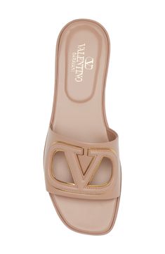 The Milan-based label's iconic VLOGO traced in metallic stands out further with crisp cutouts on a relaxed slide sandal fashioned in Italy from smooth leather. Leather upper, lining and sole Made in Italy Designer Shoes Valentino Slides, Christian Louboutin Flats, Valentino Sandals, Designer Slides, Money Outfit, Designer Flats, Fall Inspo, Girly Shoes, Fashion Hub