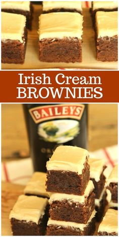 brownies with cream frosting stacked on top of each other in front of a bottle of bailey's