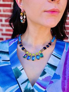 This Nailah Necklace is a work of art! With an antique gold plated brass base metal, 17" length and a 3" extension, you'll be getting compliments like it's no one's business. The high quality crystals will send you and your neckline to a new realm of sparkle. -FINAL SALE- Multicolor Brass Elegant Necklaces, Elegant Multicolor Brass Necklaces, Gold Crystal Necklace With Gemstone Accents, Crystal Multi-stone Necklace For Parties, Party Crystal Multi-stone Necklace, Party Multi-stone Crystal Necklace, Multi-stone Metal Jewelry For Party, Costume Jewelry Brass Necklaces With Jewels, Costume Jewelry Brass Necklace With Jewels