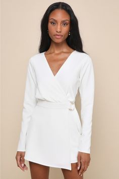 No matter how beautiful the skyline may seem, no view could compete with you in the Lulus Rooftop Bar White Long Sleeve Faux-Wrap Belted Skort Romper! This lightweight stretch-woven romper features long sleeves that fame a surplice bodice and a banded waist with a decorative gold buckle detail. A skort panel tops fitted shorts to finish the chic look! Hidden back zipper/clasp. Fit: This garment fits true to size. Length: Above mid-thigh. Size medium measures 31.75" from shoulder to hem. Inseam: Chic Wrap Top For Day Out, Elegant Wrap Top With Tie Waist For Work, Elegant Wrap Top For Brunch, Elegant Faux Wrap Top For Workwear, Elegant Faux Wrap Top For Work, Fitted Faux Wrap Top For Workwear, Elegant Fitted Wrap Top For Work, Spring Formal Fitted Wrap Top, Formal Fitted Wrap Top