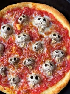 a pizza with lots of skulls on it