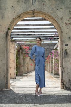 The Zarah Dress in Steel Blue is a timeless and elegant choice for any evening occasion. Made from pleated crepe, this dress drapes beautifully and flatters all body types. With a hidden zipper at the back, it provides a seamless and polished look. Dress it up or down, and pair with a belt (sold separately) for added definition. Product Details Lightweight Pleated Crepe Fabric Fitted Waist Hidden Zipper at Center Back Model Model is 5'10" and wearing size S.