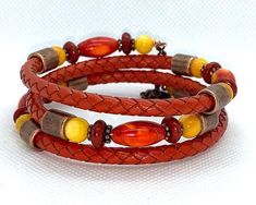 This one of a kind bracelet is made from copper memory wire and 5mm braided leather in orange and adorned with orange Agate beads, rust Howlite, yellow River Shell and antique copper metal spacers beads.  Bracelet is made of memory wire and will fit most wrist sizes.   I invite you to come on in and browse my shop's entire selection of handcrafted jewelry! https://www.etsy.com/shop/BeauFaireCreations Adjustable Brown Copper Braided Bracelets, Adjustable Copper Bohemian Braided Bracelet, Adjustable Copper Braided Bohemian Bracelet, Adjustable Bohemian Copper Braided Bracelet, Adjustable Orange Bohemian Wrap Bracelet, Paper Bead Bracelet, Yellow River, Orange Agate, Memory Wire Bracelet