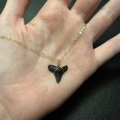 A fossilized shark tooth pendant on an 18-inch 14k gold-filled chain. NOTE: The size and shape of the tooth may vary, but they will be close to the shown image! These shark teeth are ethically sourced and over 10,000 years old (but could be up to 400 million so finding exact matches can be a bit difficult! Shark Teeth Bracelet, Gold Arrowhead Jewelry Gift, Gold Arrowhead Necklace Gift, Gold Arrowhead Necklace As A Gift, Gold Arrowhead Necklace For Gift, Gold Arrowhead Jewelry For Gift, Nickel-free Arrowhead Necklace Gift, Nickel-free Arrowhead Necklace For Gift, Nickel Free Arrowhead Necklace For Gift