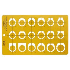 a yellow ruler with white circles and numbers on the front, in half circle shapes