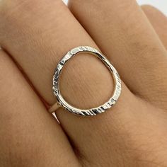 "Rings are made out of 14 gauge sterling silver. The circle has an inner diameter of about 13mm and a shank with a thickness of about 1.6mm. The face of this ring has been coin edge hammered. Karma Rings are said to represent the phrase, \"What goes around, comes around\" and serves as a reminder that whatever good you do, will ultimately come back to you. The open circle also represents eternity as a circle does not have a start or end. These rings make excellent gifts and still maintain a mode Open Circle Ring, What Goes Around Comes Around, A Start, Geometric Ring, Circle Ring, Gold Ring Stack, Ring Sizer, Hammered Silver, One Ring