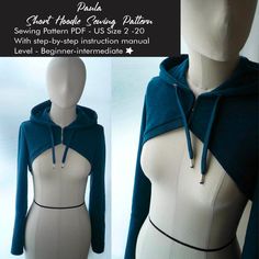 a mannequin wearing a blue hoodie with zippers on the front and back