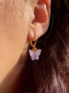 These dainty gold butterfly earrings are one of our best selling items! Perfect for summer, these lightweight earrings will be your new go-to! Our Butterfly Earrings are totally customizable! You can choose silver or gold outline AND the color of the pearl wings! The available colors can be seen in our options box ~ ~ Wear alone or stack these earrings for a cute look~  ~ Light weight and made personalized because we care about sensitive ears! Style of Earrings offered: ~ Regular: made to order with gold plated huggie earrings (hoop style earring wither lever backing). ~ 18K Hook: made to order with 18K gold plated ear wire hooks ~ Stainless Steel/Gold: made to order with stainless steel or stainless gold huggies to match the charm!~ This listing is for one (1) pair of Earrings! 🔮Crystals Trendy Butterfly Charm Jewelry, Spring Gold Jewelry With Butterfly Charm, Hypoallergenic Summer Earrings, Pink Butterfly Jewelry For Summer, Trendy Butterfly Jewelry For Summer, Trendy Butterfly Shaped Summer Jewelry, Trendy Summer Butterfly Shaped Jewelry, Butterfly Charm Hoop Jewelry Gift, Everyday Butterfly Charm Jewelry