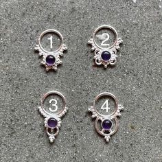 These are soooooo pretty. Made is 925 sterling silver with tribal details, set with a bright amethyst  stone. The rings are all 1cm (.40”) in diameter. The wire is 20 gauge.Stones shine light through them since the back is open. Hard to see this when they are lying flat in the pic. Each piece is made BY HANDOne of the images contains numbers to specify which you would like from the drop down menu. Silver Stackable Amethyst Birthstone Rings, Sterling Silver Birthstone Piercings, Dainty Sterling Silver Amethyst Ring, Sterling Silver Body Jewelry, Silver Amethyst Stackable Jewelry, Silver Stackable Amethyst Jewelry, Silver Amethyst Ring, Spiritual Birthstone, Spiritual Silver Amethyst Ring In Sterling Silver, Pierced Sterling Silver Belly Rings