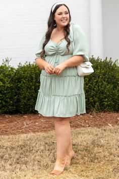 Don't you love how cute this dress is! The pistachio color is perfect for spring and the cinched bust with a tie is so cute! The loose, flowy, tiered style is so flattering on everyone and the bubble sleeves are so sweet! Style this cutie with some neutral heels and a fun accessory for the perfect look! 100% Polyester Flowy Casual Tiered Dress For Garden Party, Casual Flowy Tiered Dress For Garden Party, Green Tiered Mini Dress For Brunch, Green Tiered Vacation Dress, Green Tiered Dress For Vacation, Green Flowy Tiered Dress For Vacation, Green Tiered Dress For Garden Party, Flowy Green Tiered Dress For Vacation, Spring Sage Dresses For Brunch