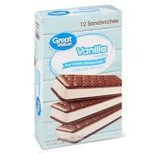 three ice cream sandwiches are stacked on top of each other in front of a cardboard box