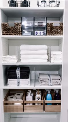 an organized closet with linens, toiletries and other items