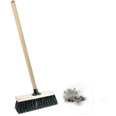 a broom and dust on a white background