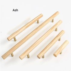 six wooden dowels are shown on a white background with the words ash above them