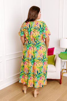 - Head to happy hour by the beach with this vibrant dress! - Lightweight material with a colorful abstract botanical print - A built-in partial lining ending - A v-cut neckline that goes down into a drawstring ruched bodice with a tie detail - Short puff sleeves with elastic cuffs - A waistline with an elastic back - Functional side pockets - A relaxed silhouette that ends in a straight hemline Vibrant Dress, Abstract Botanical, The Maldives, Ruched Bodice, By The Beach, Botanical Print, V Cut, V Cuts, Colorful Abstract