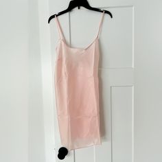 Crafted In Semi-Sheer Fabric With A Luxe Sheen, This Flirty Slip Showcases Chic Simplicity For A Touch Of Quiet Luxury In Your Wardrobe. Low V-Back Styling Adjustable Straps Hits At Mid Thigh Machine Wash Sheer Camisole Slip Dress For Spring, Spring Sheer Camisole Slip Dress, Sheer Cami Slip Dress For Summer, Pink Sheer Slip Dress For Summer, Feminine Sheer Slip Dress, Spring Sheer Cami Dresses, Pink Sheer Slip Dress, Sheer Pink Slip Dress, Feminine Sheer Slip Dress For Summer